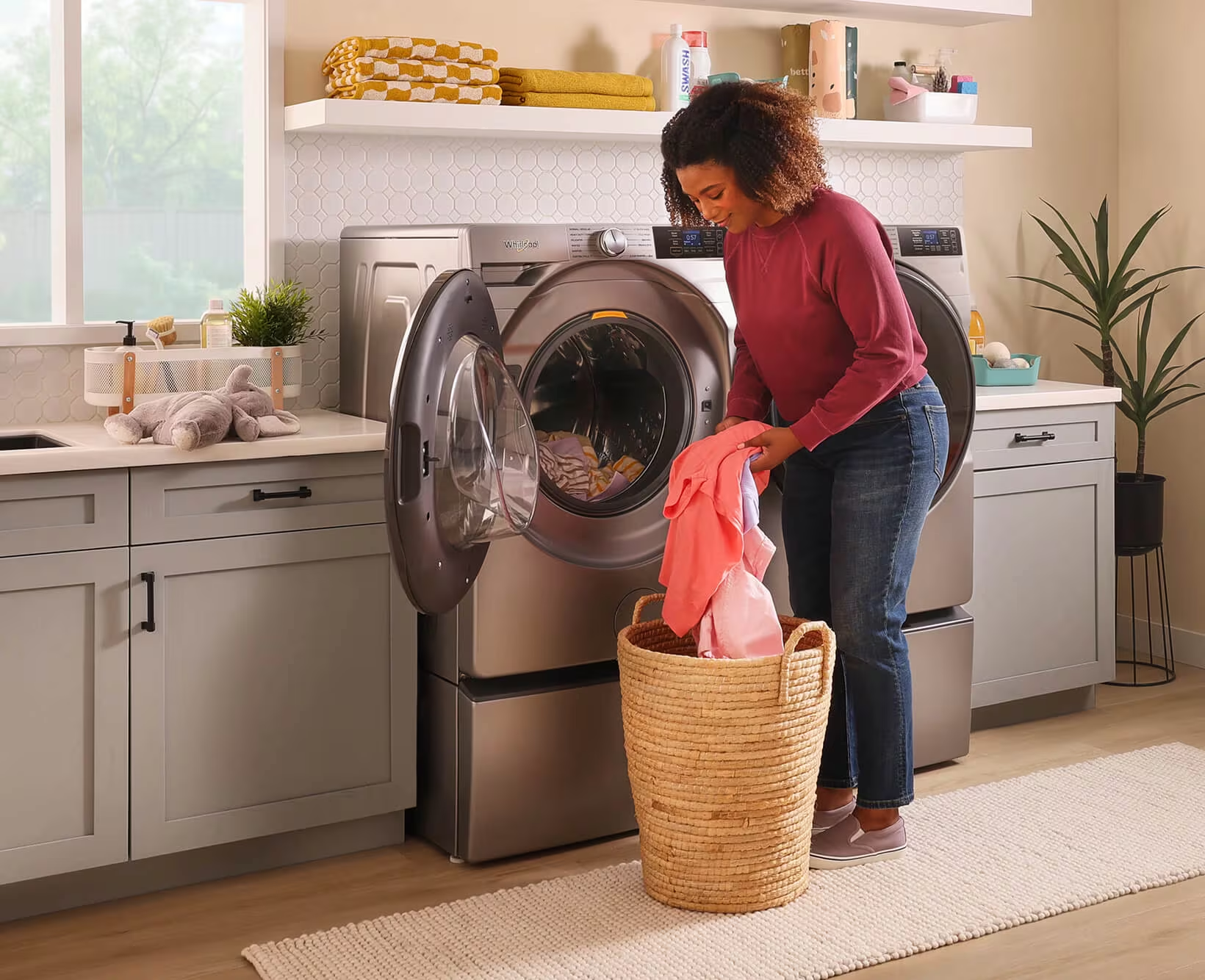 Woman loading washing machine